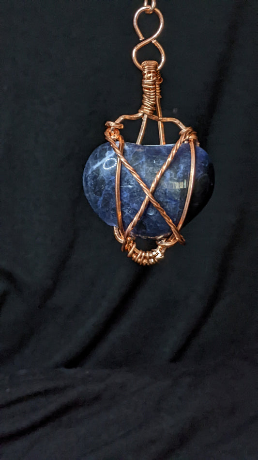 Hand cut heart shaped sodalite pendant